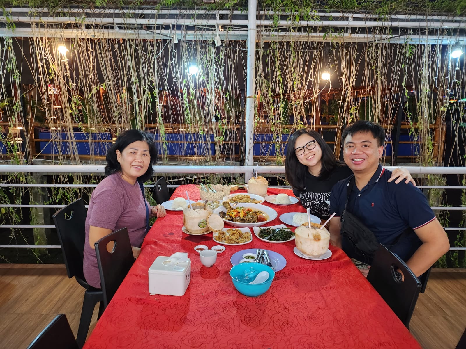 Angelia and Daniel sharing a seafood meal with family.