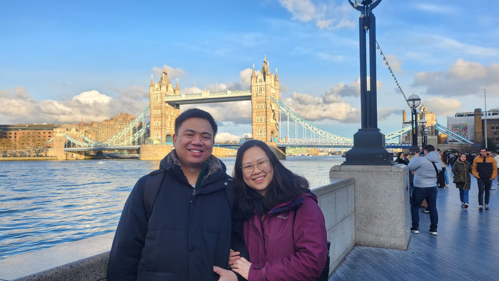 Angelia and Daniel in front of Tower Bridge in London.