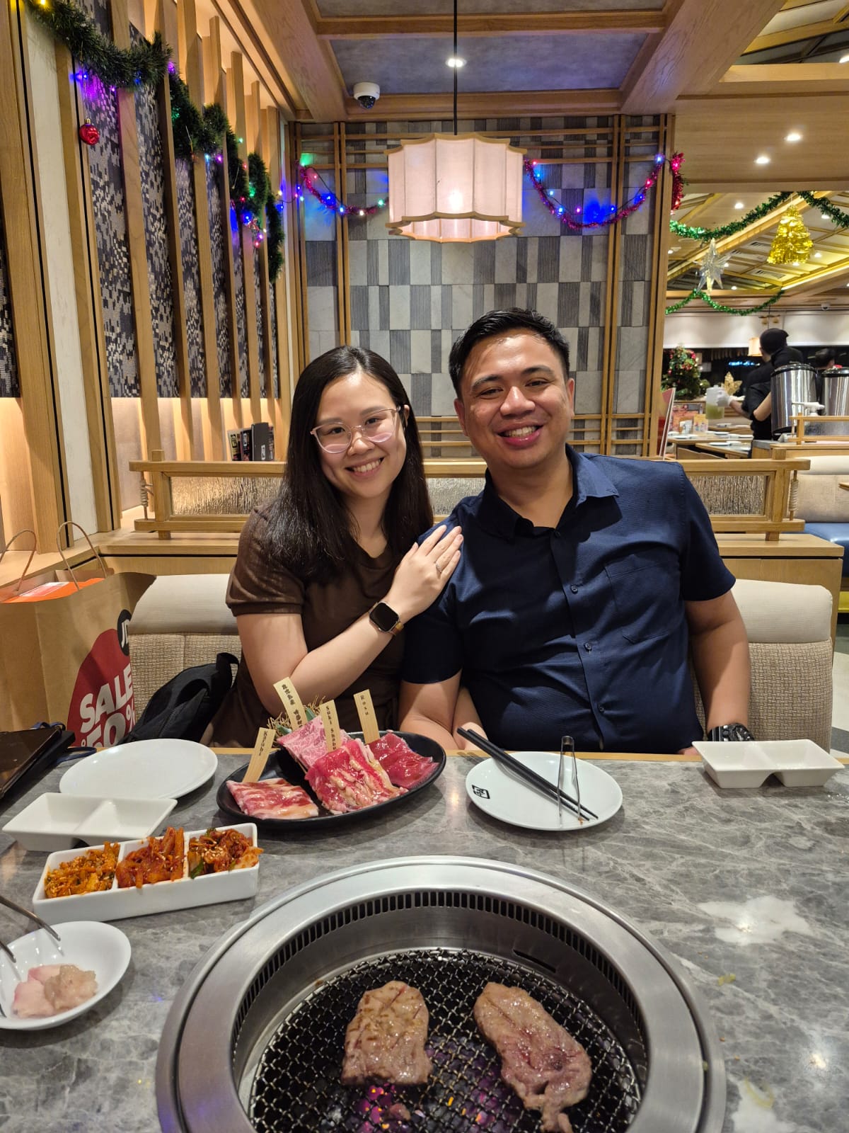 Angelia and Daniel together at dinner.